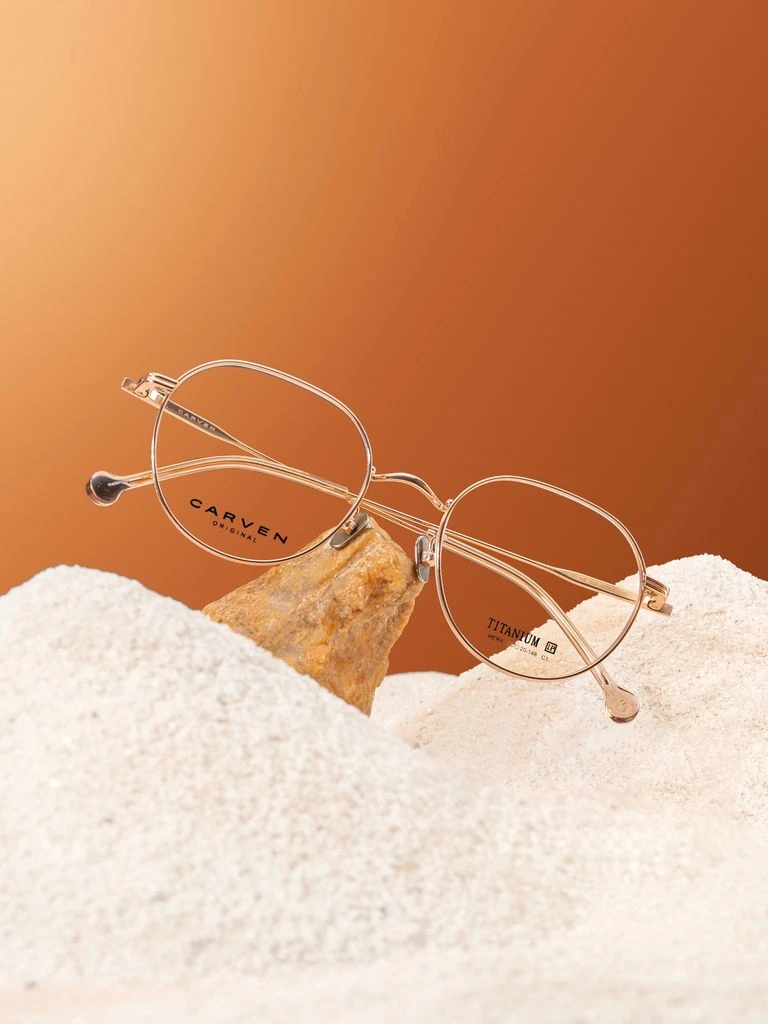 The RightEar Pulse Pro hearing aid on a walnut desk.